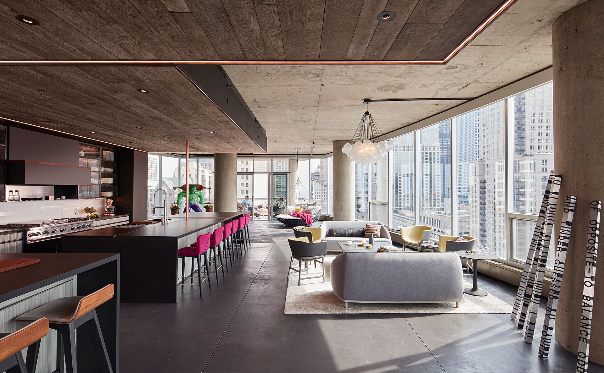 Gold Coast Penthouse — Open penthouse living space overlooking Chicago through full-height glazing